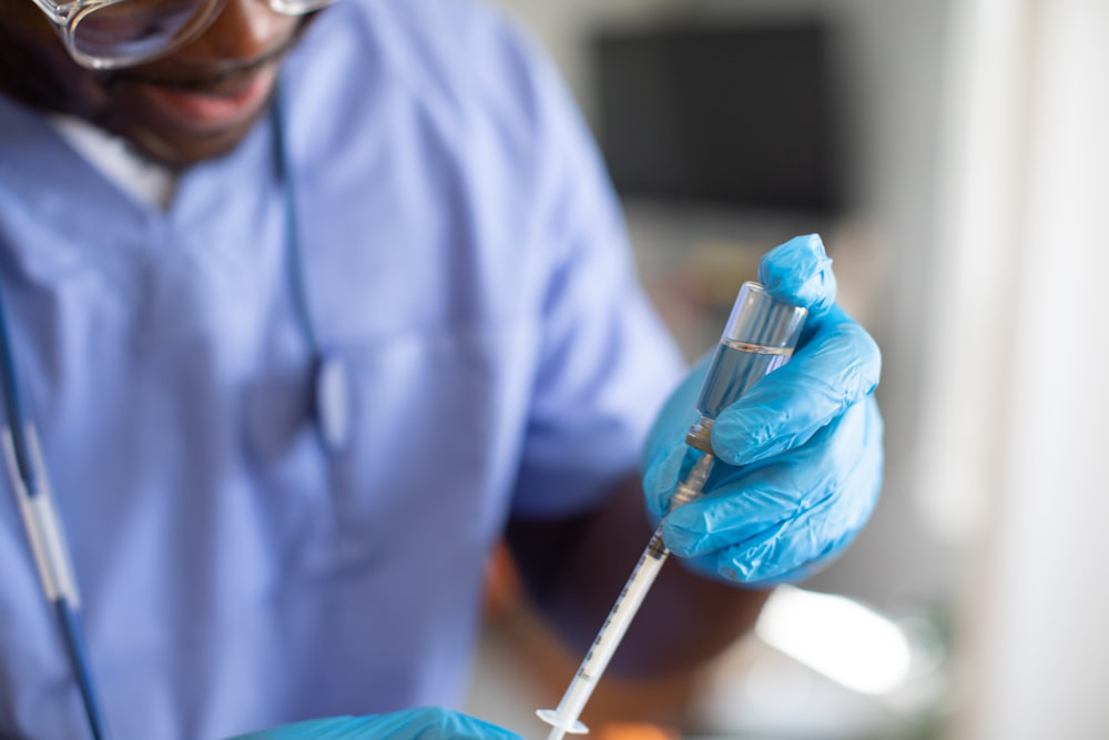 A Healthcare Professional Extracts a Weight Loss Medicine with a Syringe