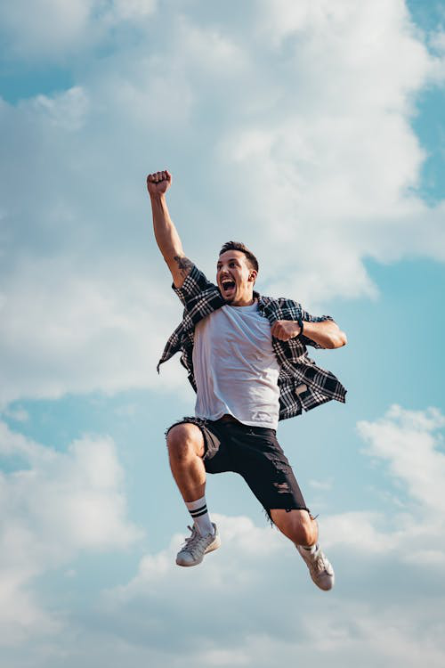 A Man Jumps in the Air After Getting a Big Boost of Energy