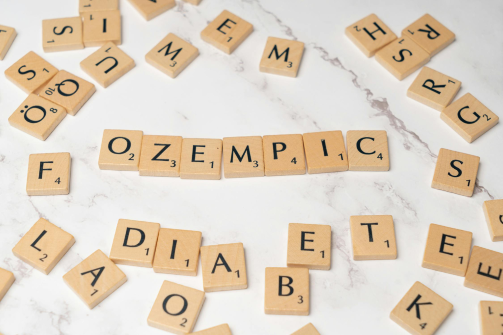 Ozempic written with Scrabble tiles