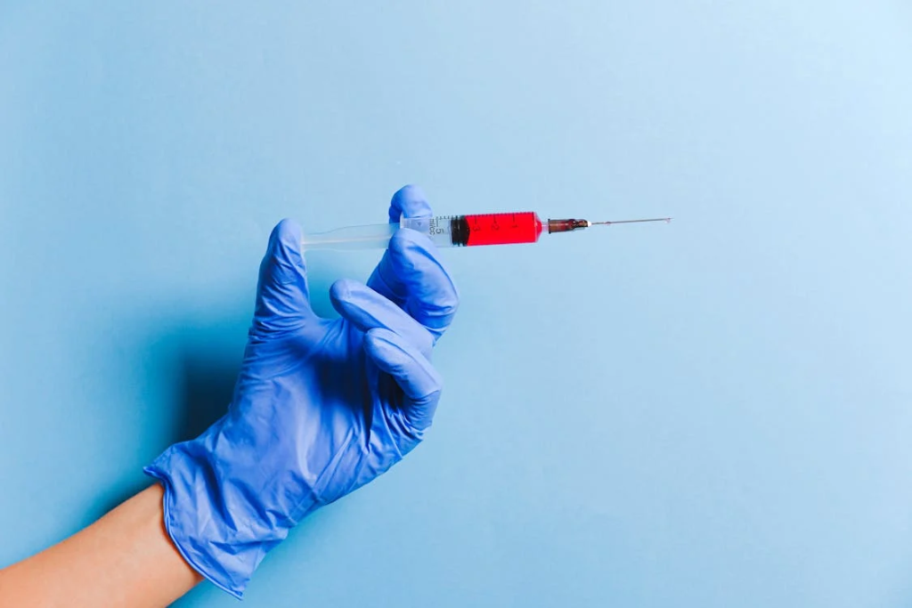 A person holding a syringe