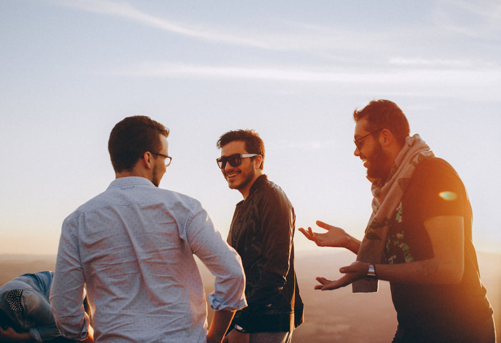 A group of men laughing and enjoying time together outdoors