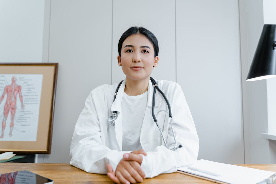 A doctor in a consultation room, ready to discuss weight management solutions.