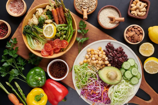 A top view of a healthy Buddha bowl dish with vegetables and legumes.