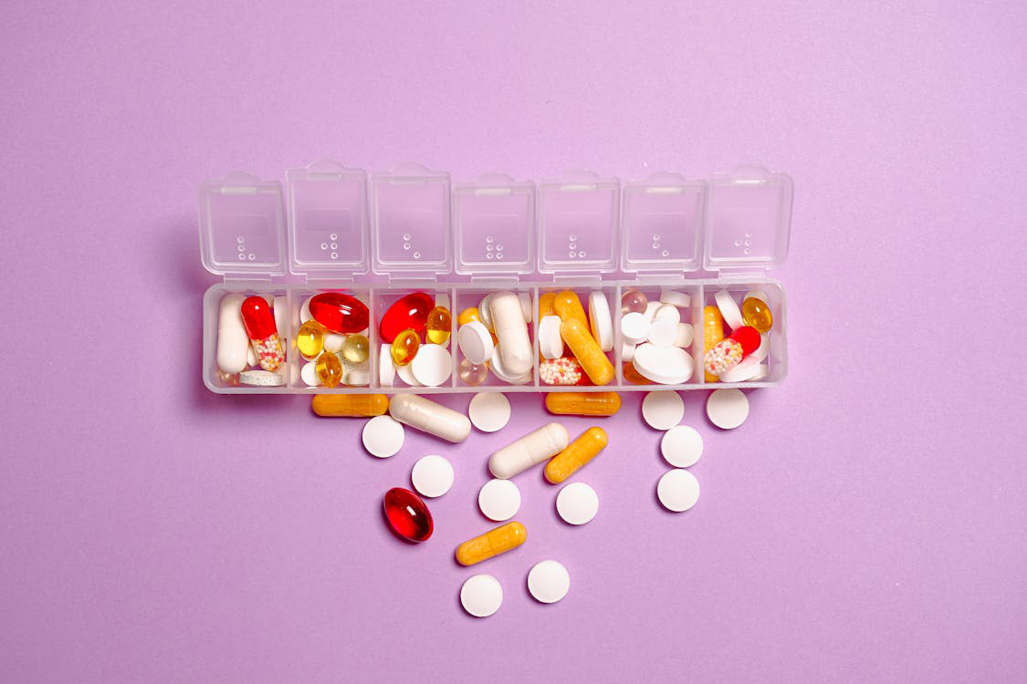 medication pills on a white plastic container