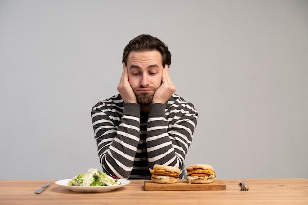 A person attempting to eat healthy food.