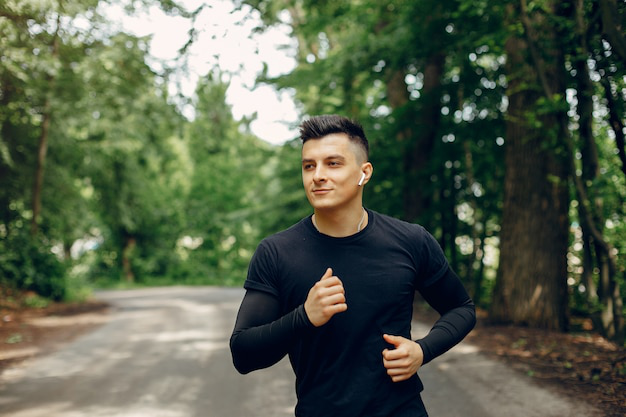 A man jogging in a park on a sunny morning.
