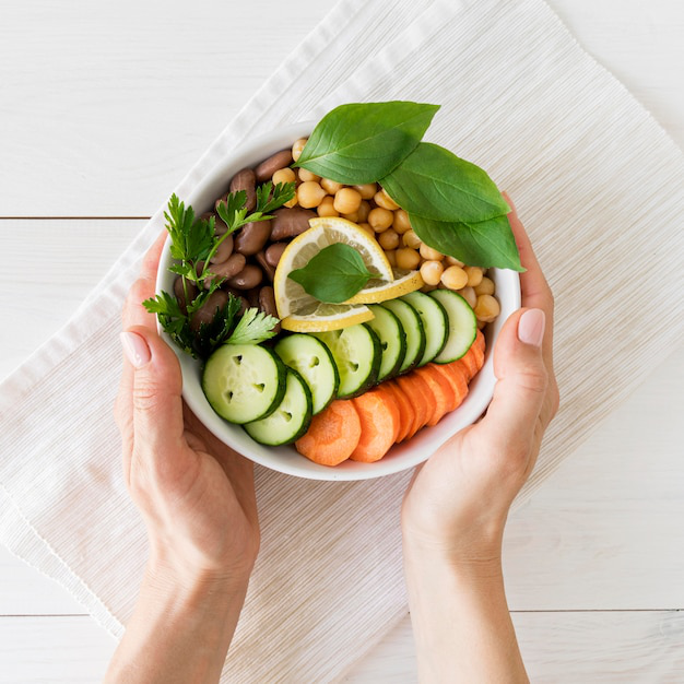 A flat lay of healthy food including fruits, vegetables, and grains.
