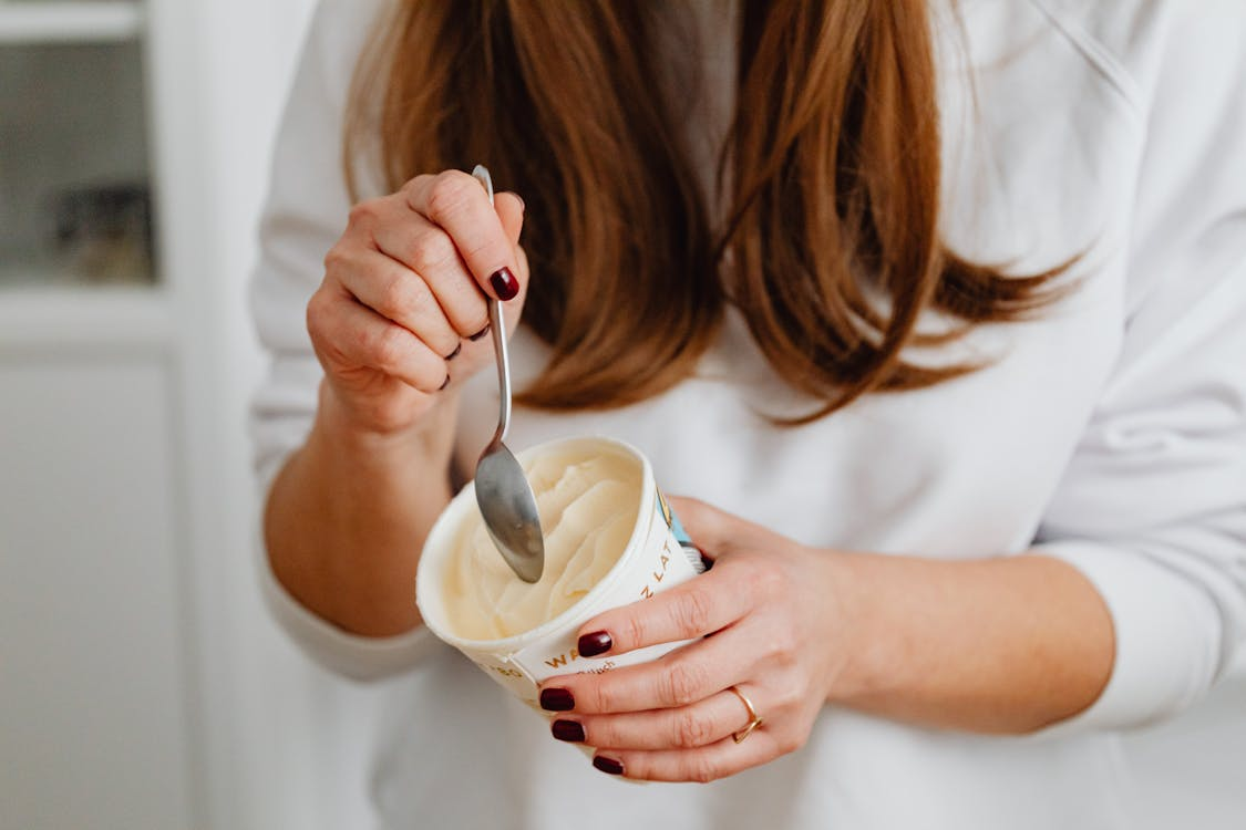  Woman eating ice cream from a container