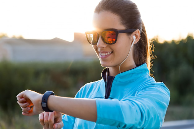 woman using wearable health tracking device