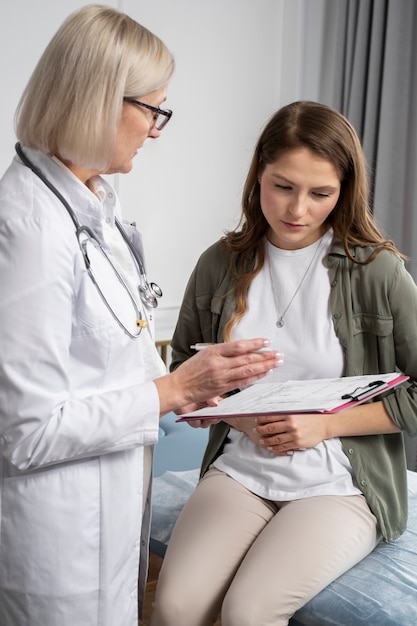 Doctor reviewing medical test results with patient during weight loss consultation