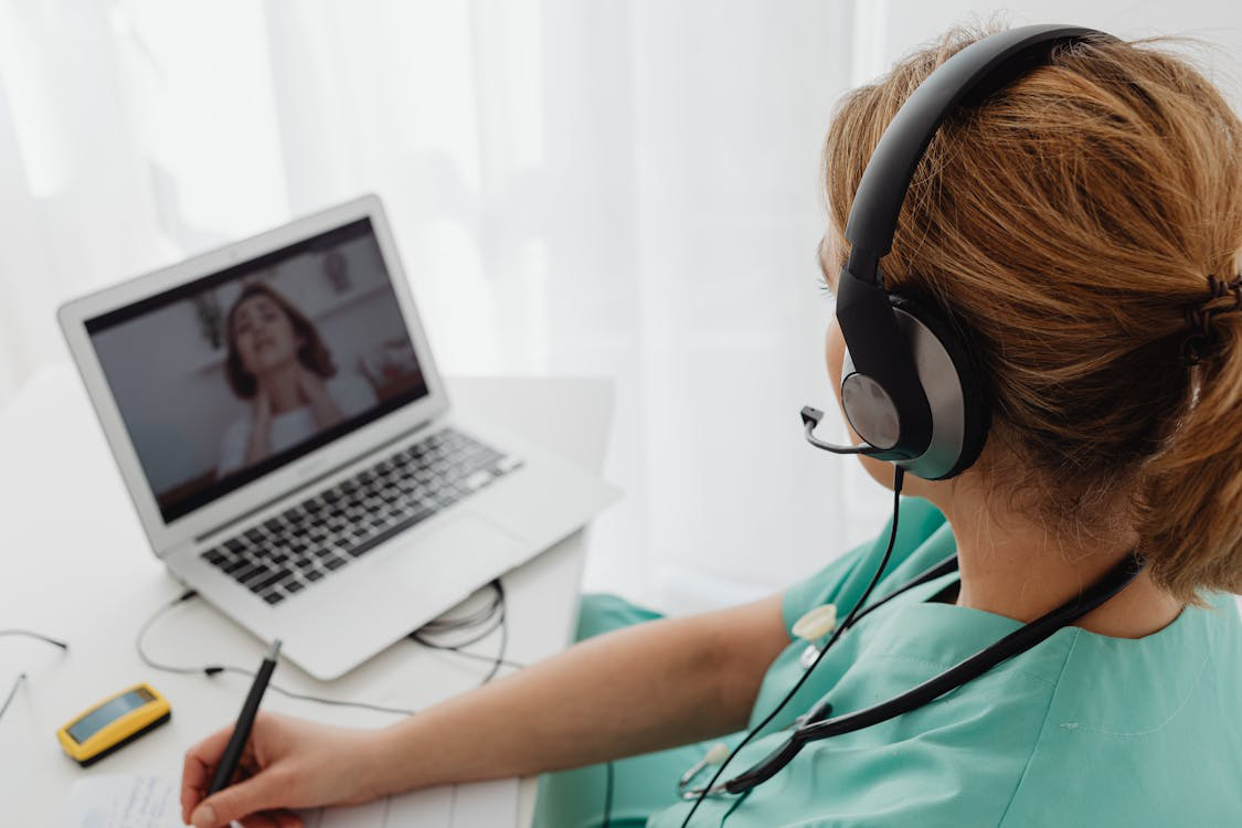 Medical professional conducting a virtual telehealth consultation for weight loss support