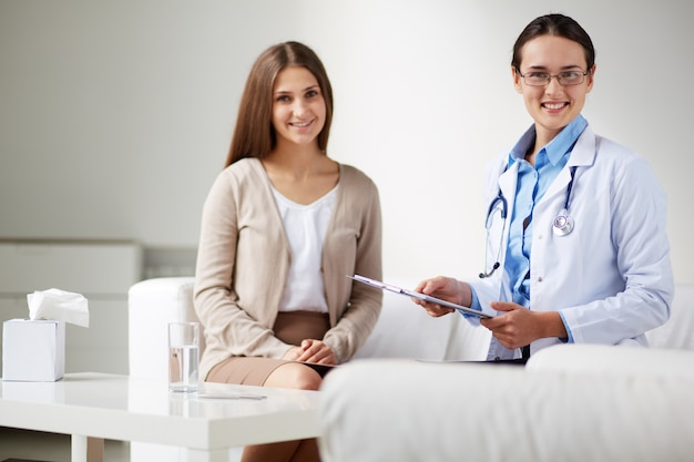 Female patient smiling during consultation with a doctor