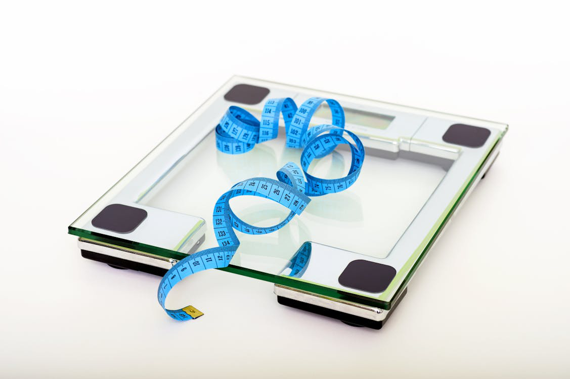 A weight machine and measuring tape