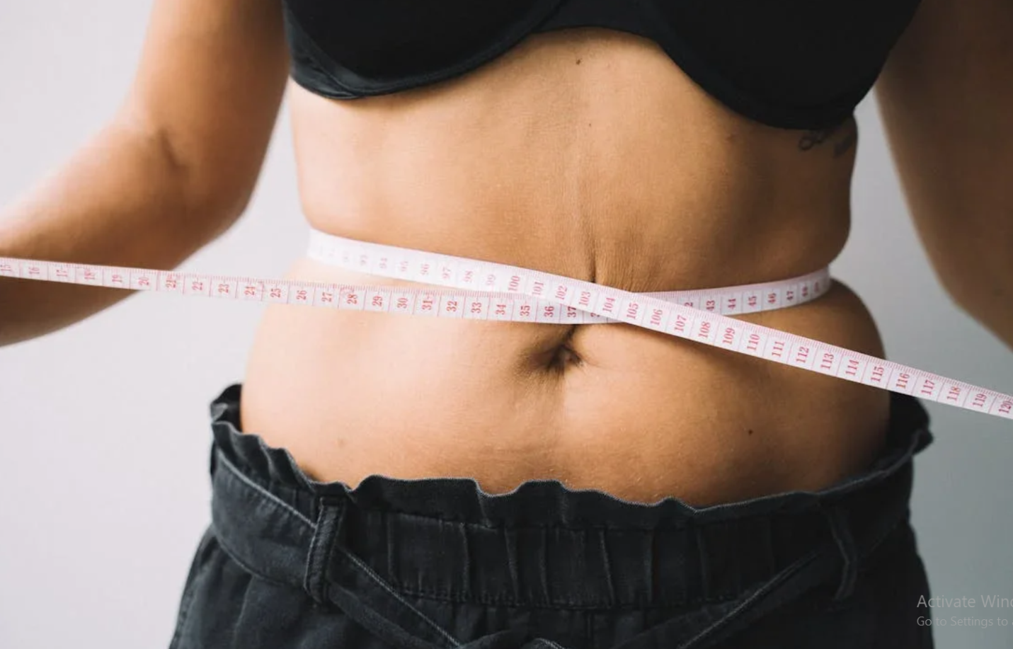 Cute dog with a flower crown on its head.