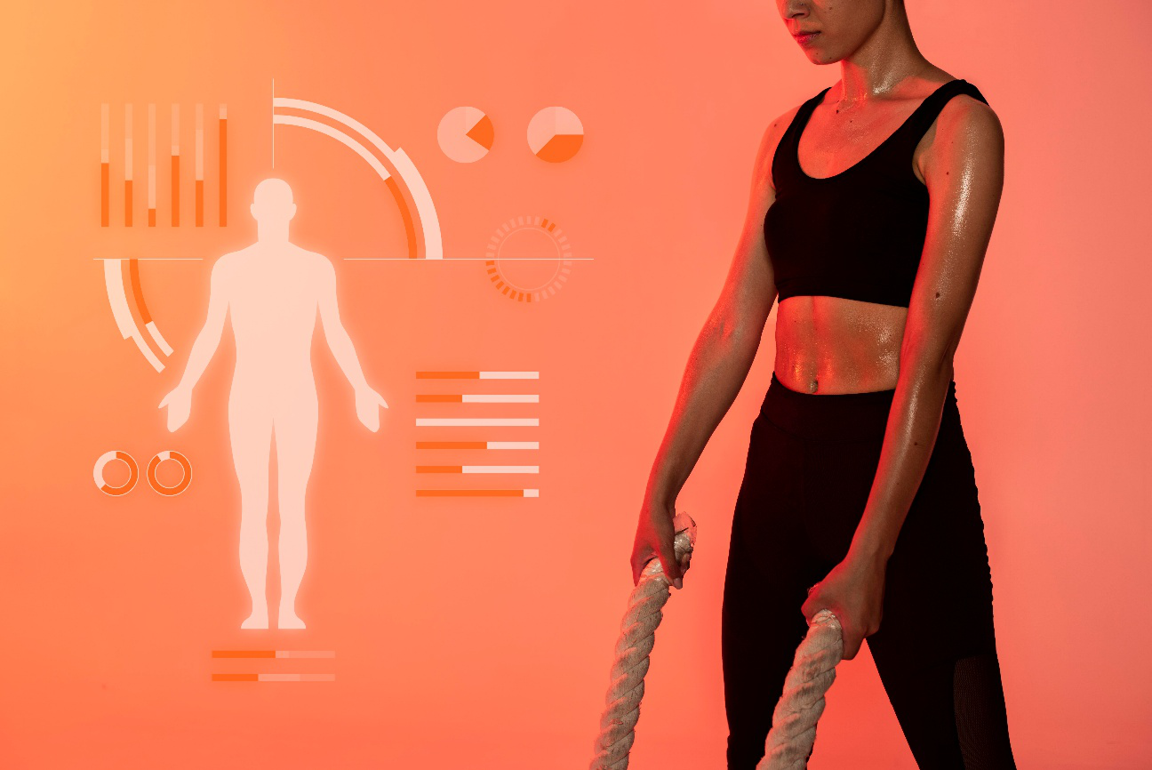 Woman exercising with fitness data and human body scan graphics in the background