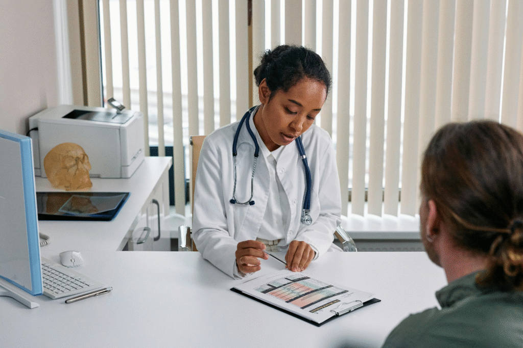 Female doctor reviewing lab results with male patient during a low testosterone consultation