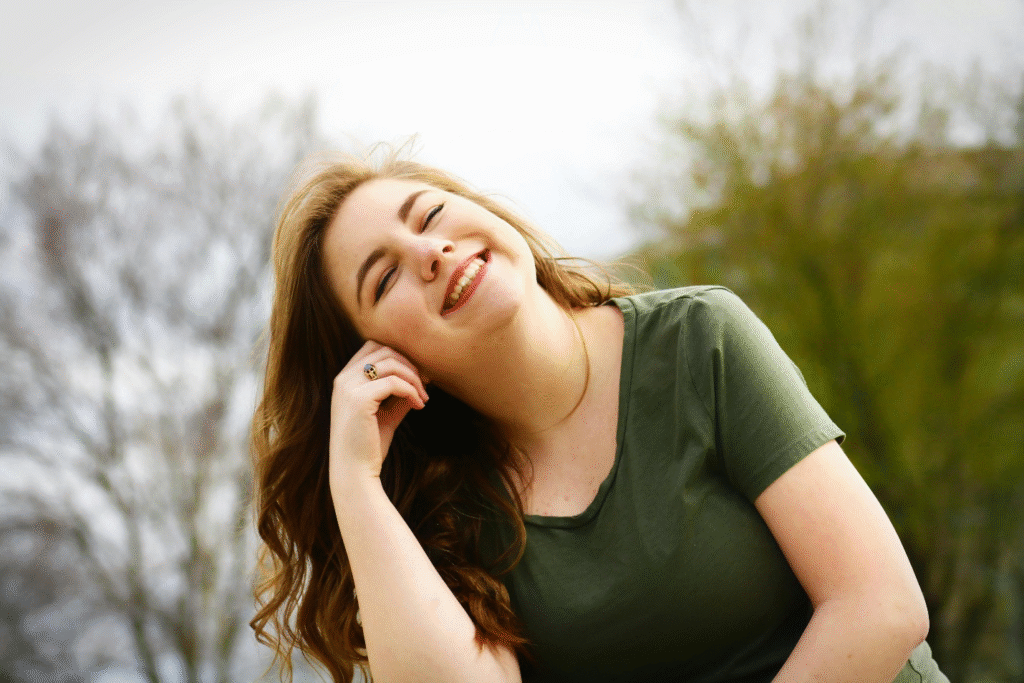 Smiling woman outdoors, feeling refreshed and energized