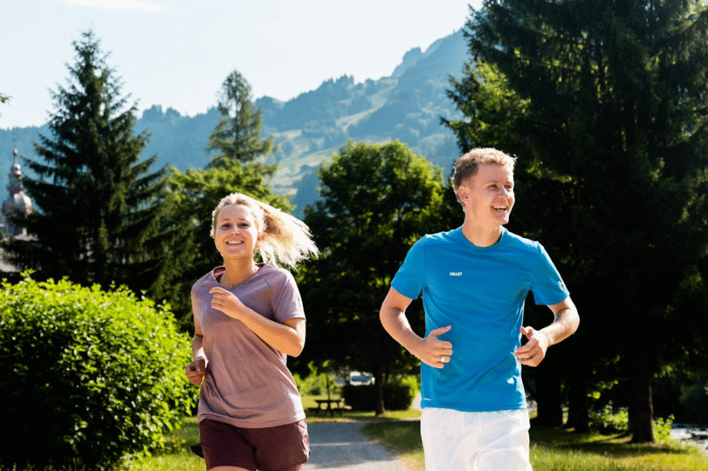 An image of a man and a woman running 