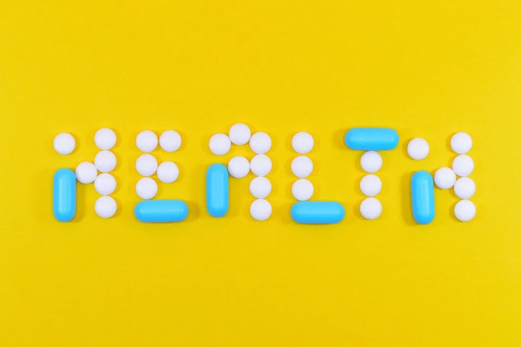 An image of the word health written using blue and white pills