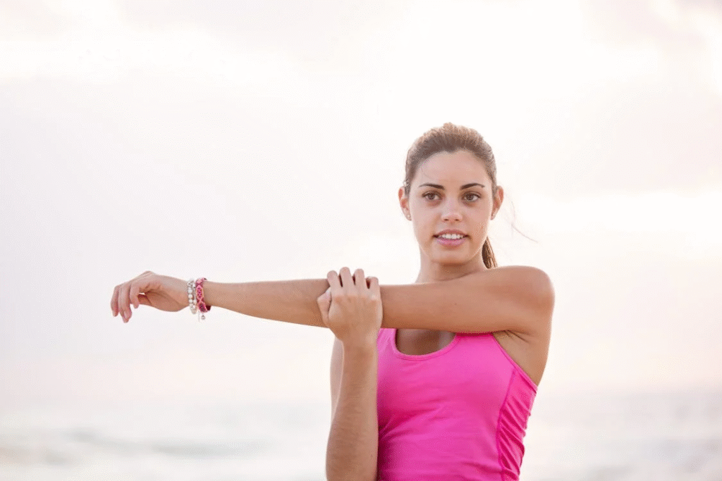 An image of a woman in a pink top   