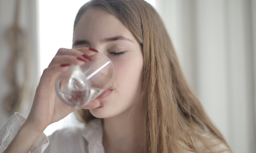 An image of a woman drinking water