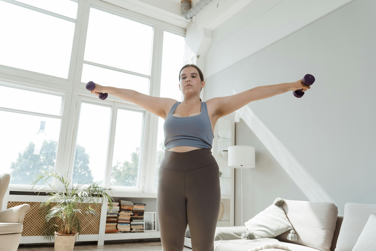 a woman working out at home.