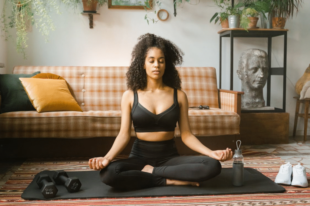 a woman holding an exercise ball.