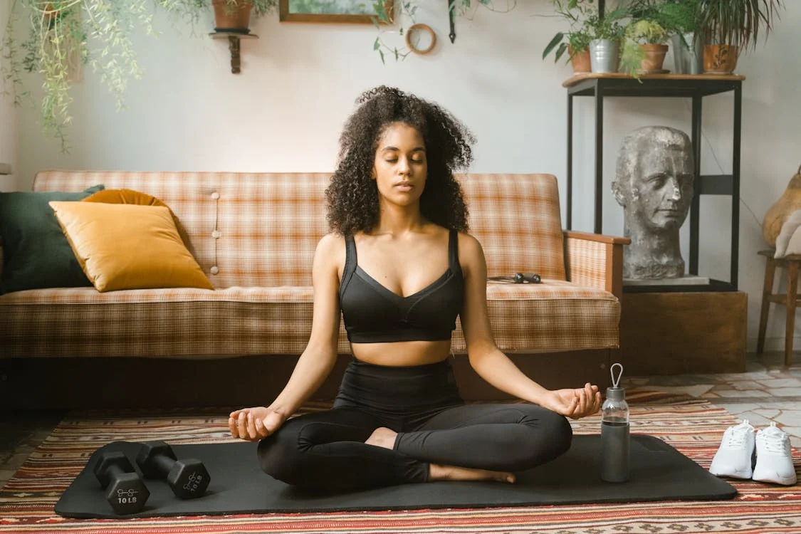 a woman holding an exercise ball.
