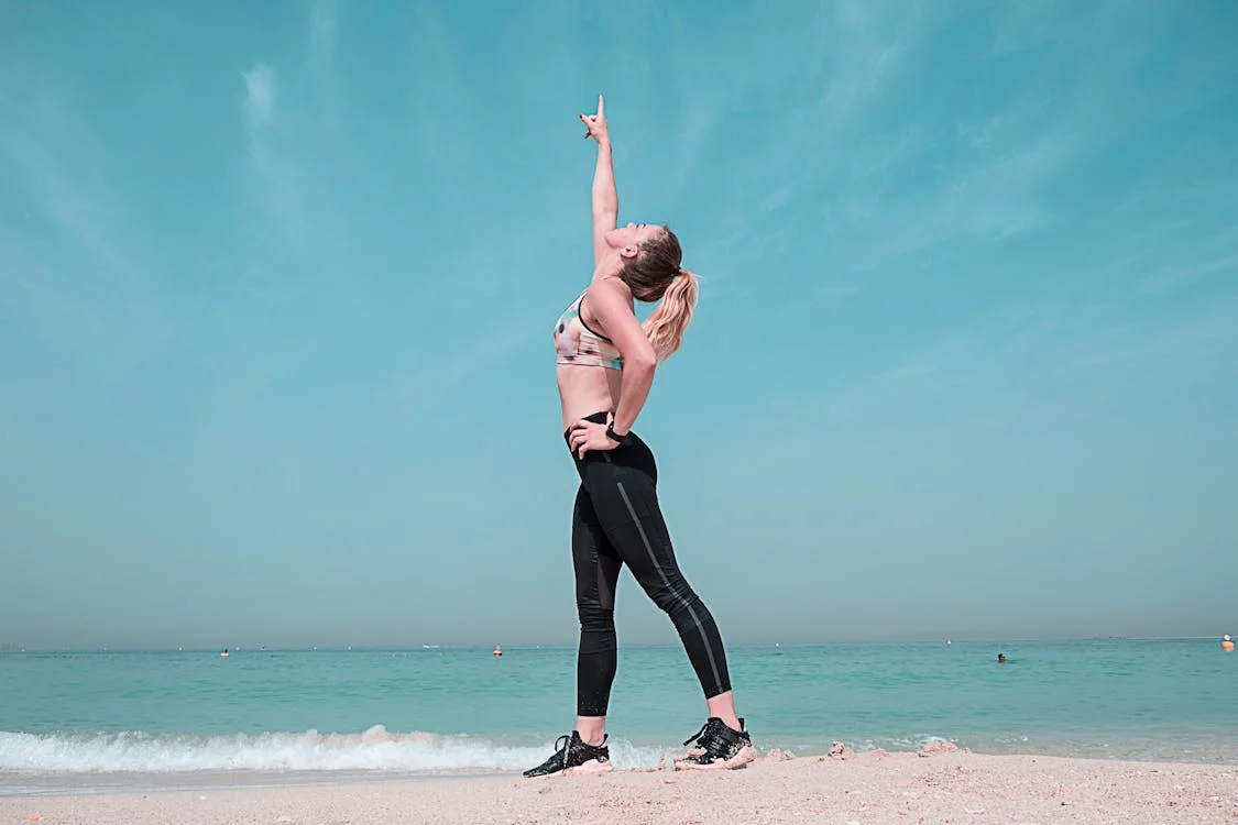 A woman feeling revitalized after getting peptide therapy for weight loss.