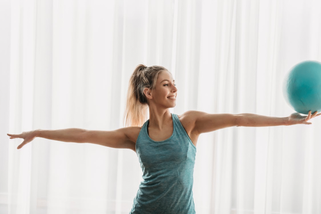 a smiling woman exercising.