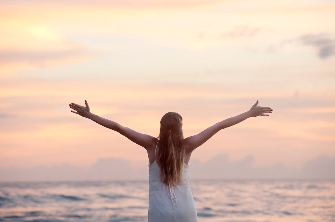 a woman enjoying the sunset.