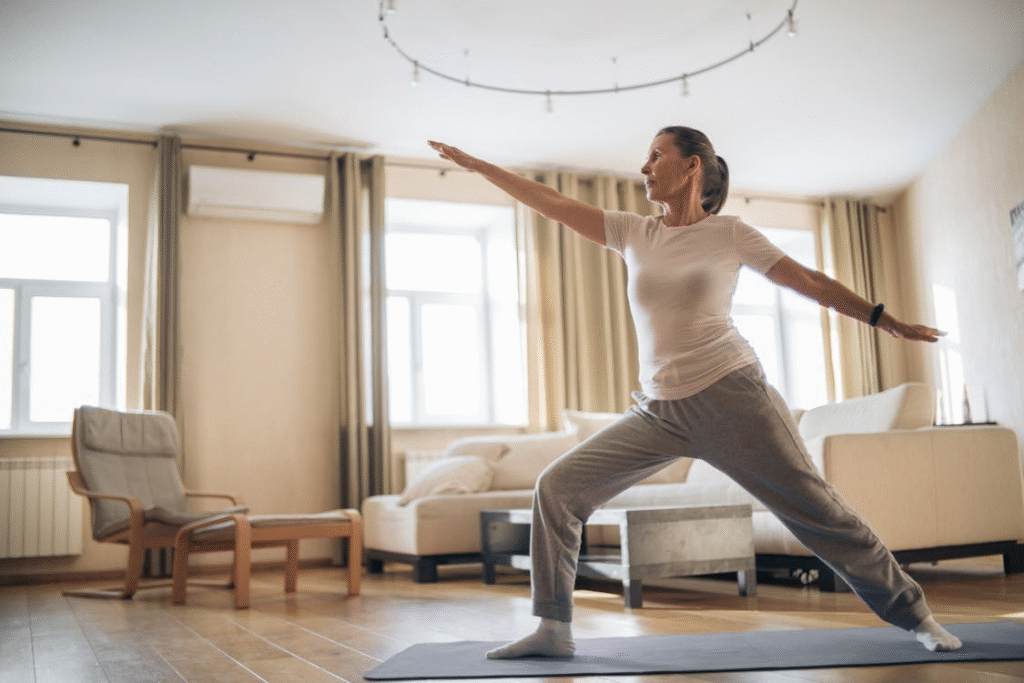 a woman in a white shirt stretching her body.
