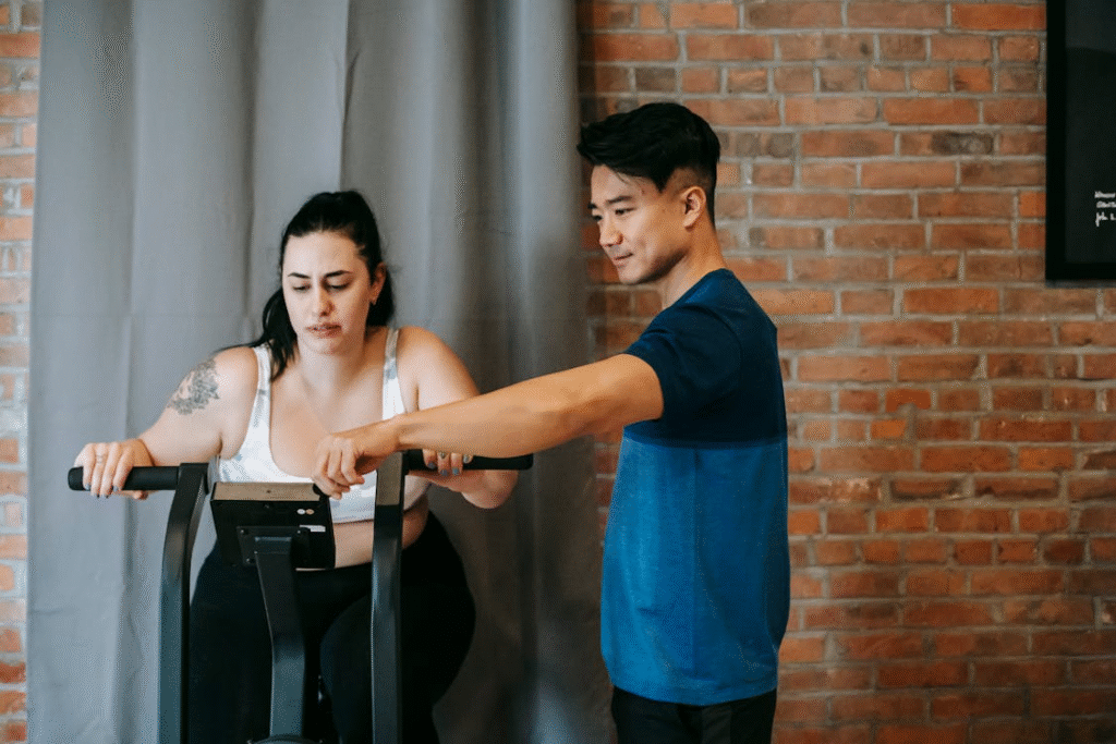 a woman in a white tank top working out.