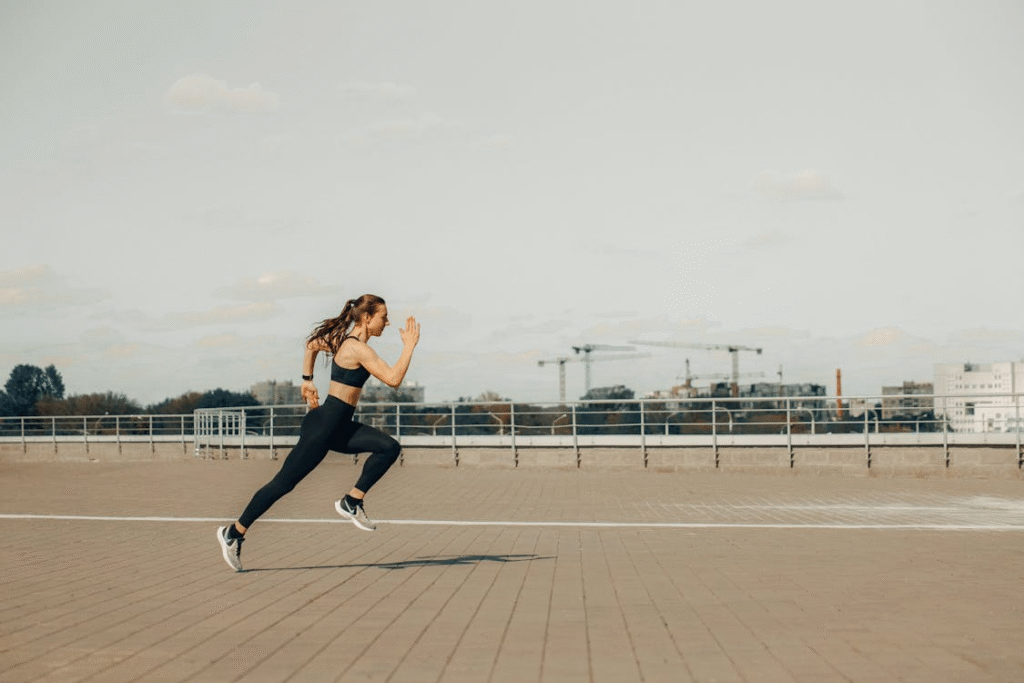 a woman running outdoors. 