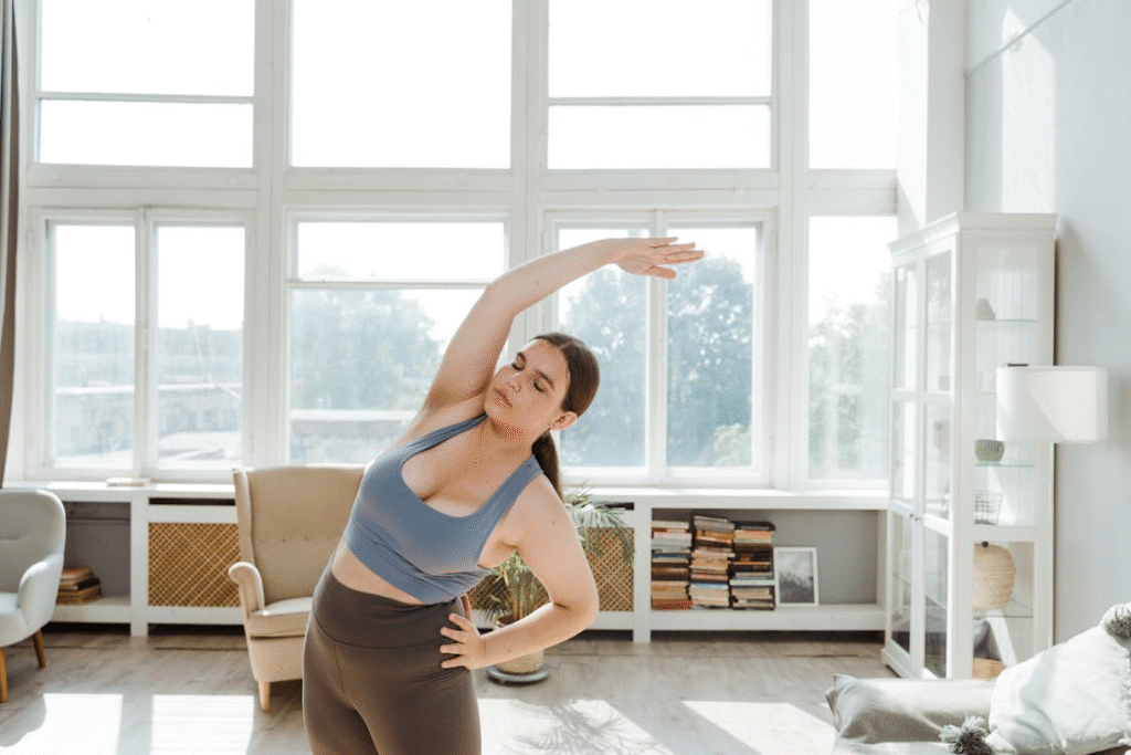 a woman in a room with big windows. 