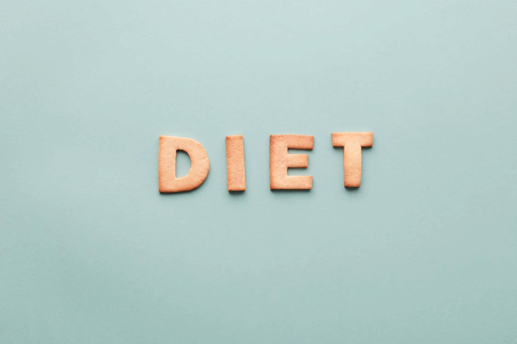 An image of letters spread on a blue surface reading “diet”