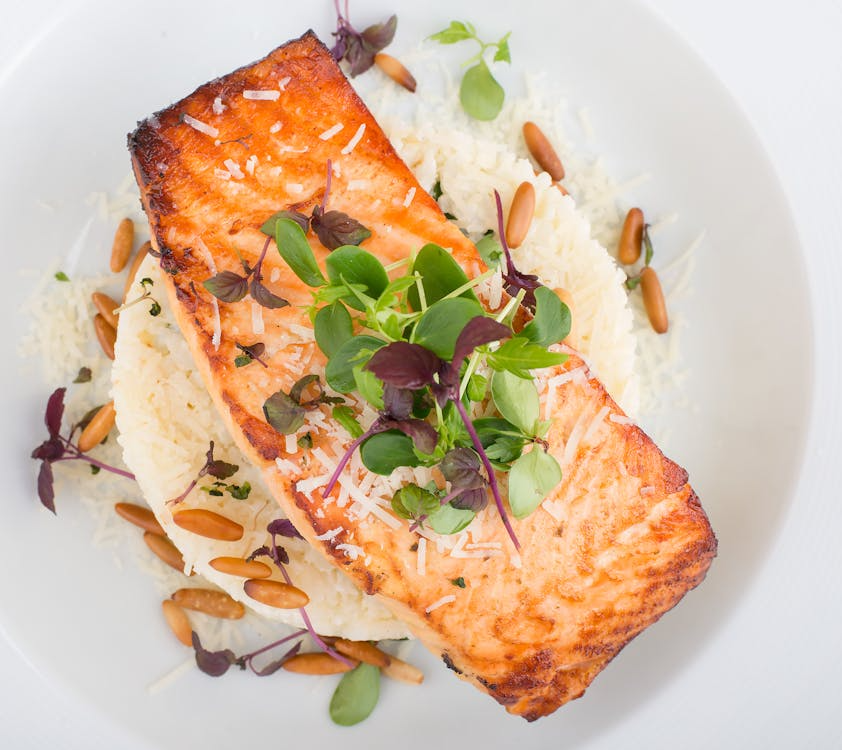 An image of salmon on top of white rice