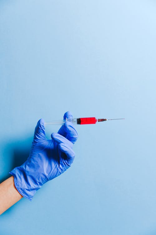 An image of a person holding a Lipo-C injection