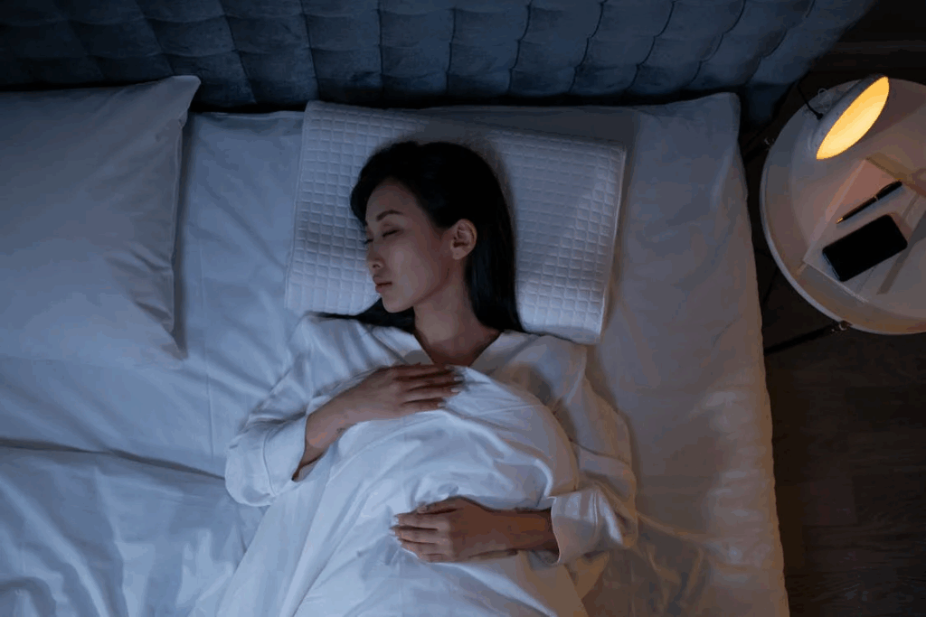 An image of a woman sleeping in bed