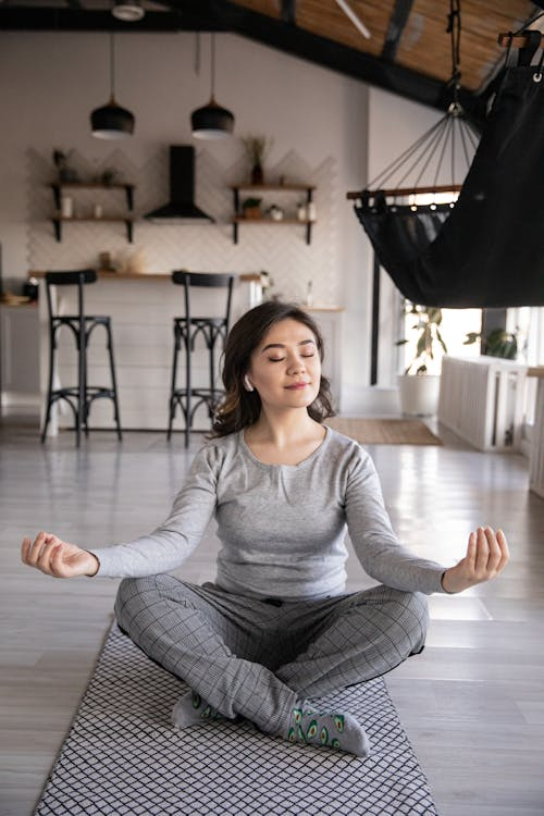 An image of a woman practicing yoga