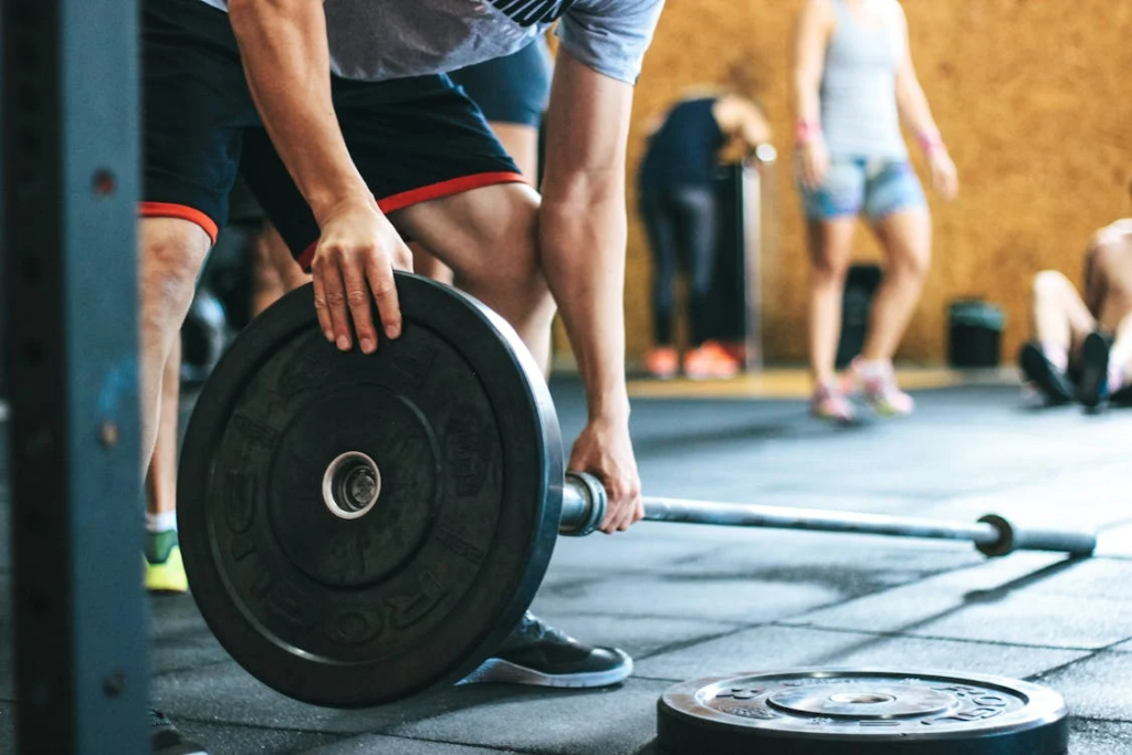 An image of a man holding a barbell