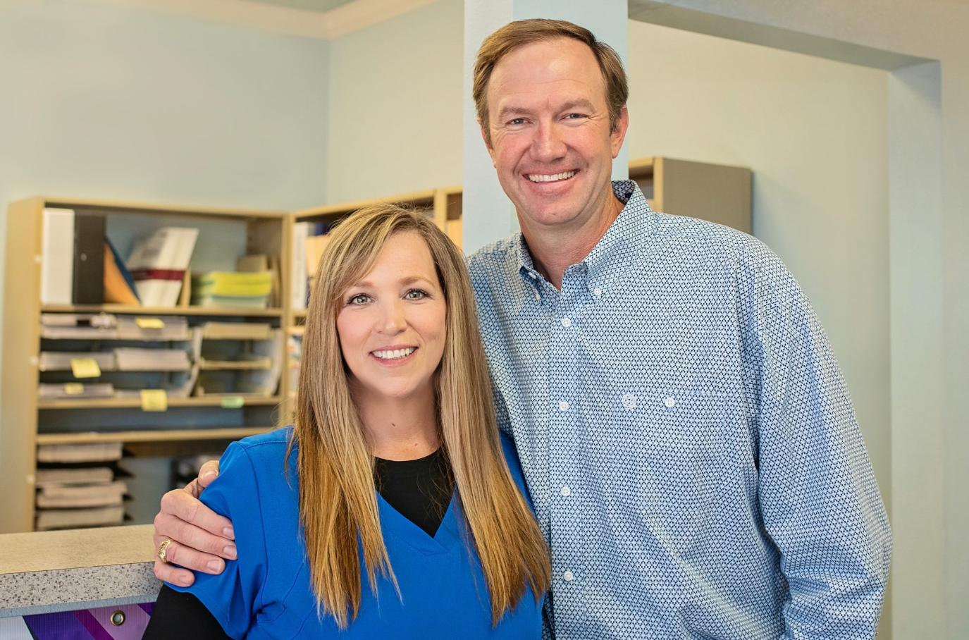 A couple of people working with each other.