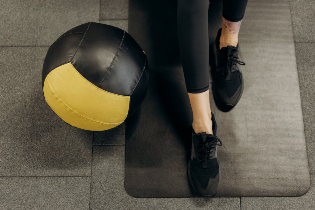 Adult resting after exercise in a calm and well-lit fitness space