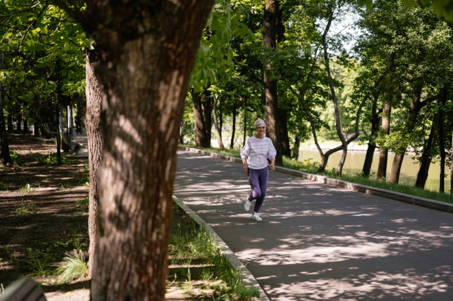 Adult walking outdoors with an active and healthy posture