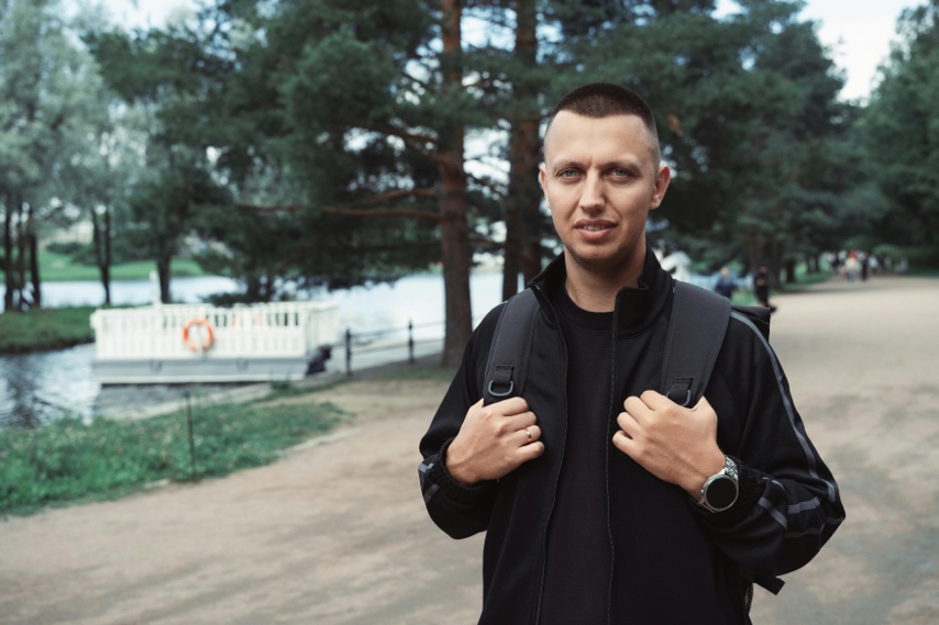 Adult walking outdoors with a relaxed and energized expression