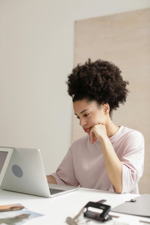 Adult working on a laptop with strong focus in a calm environment
