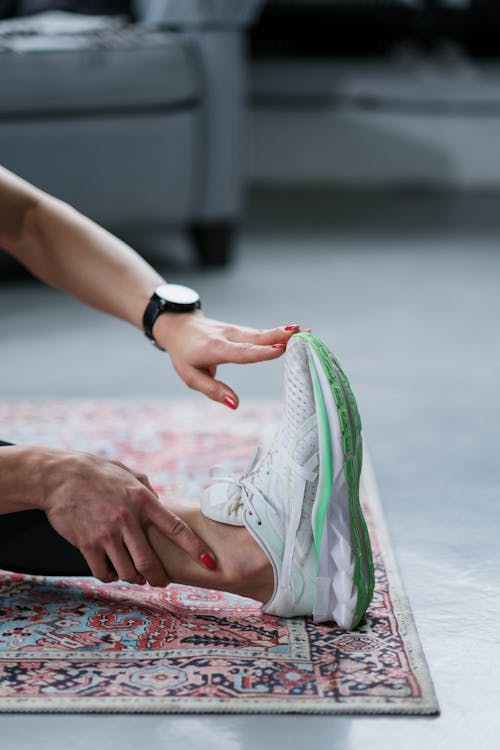 An image of a woman touching her toes while stretching