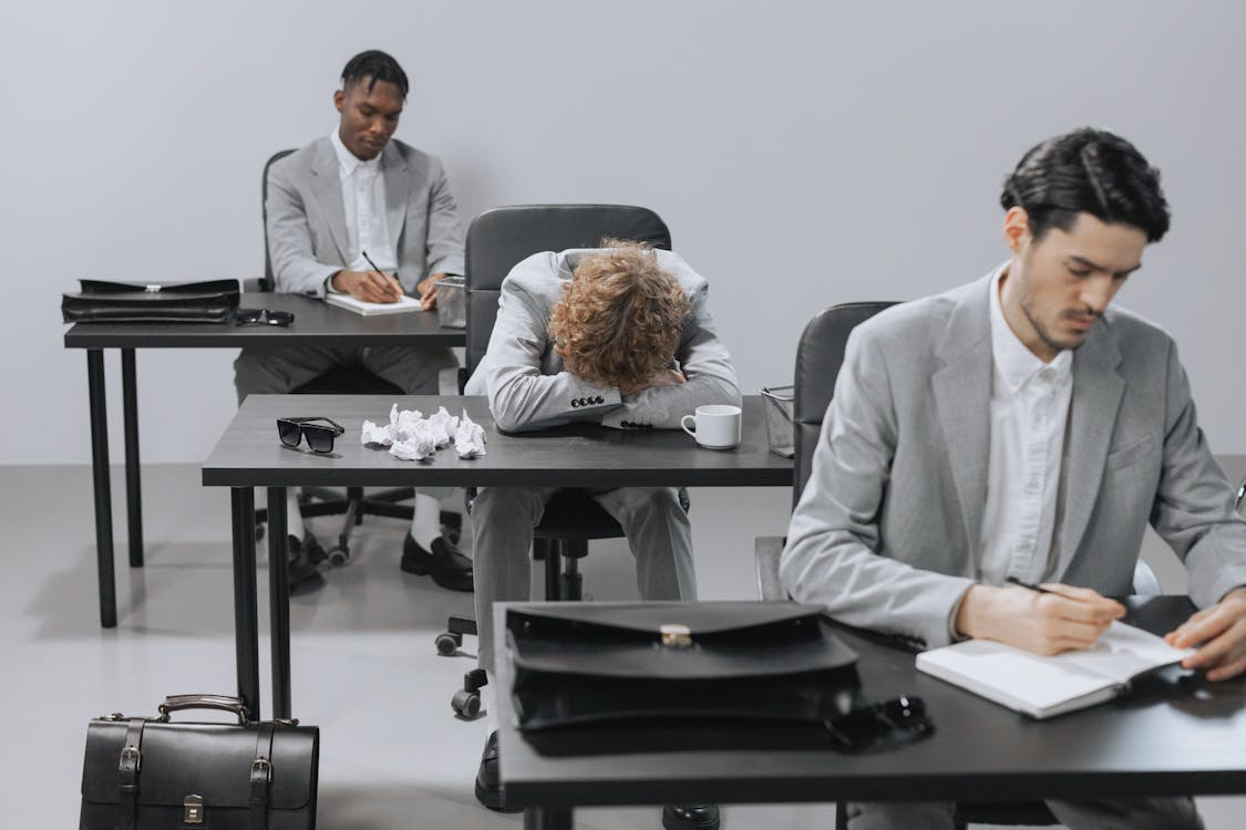 Office worker resting at a desk due to fatigue