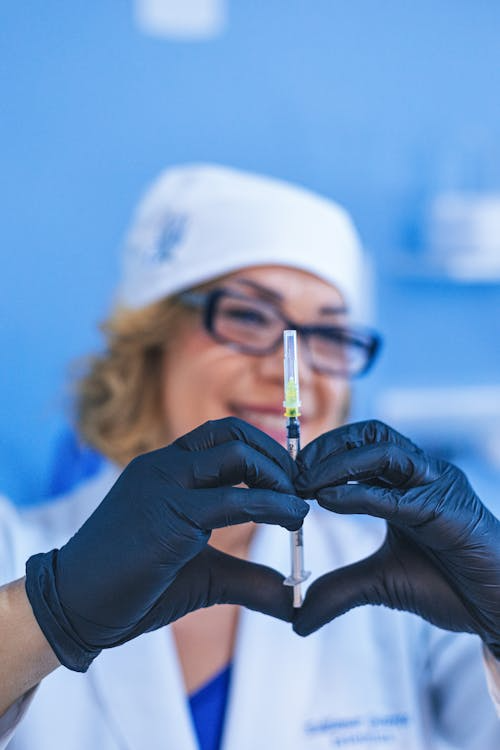 a healthcare provider preparing an injectable treatment at a medical clinic
